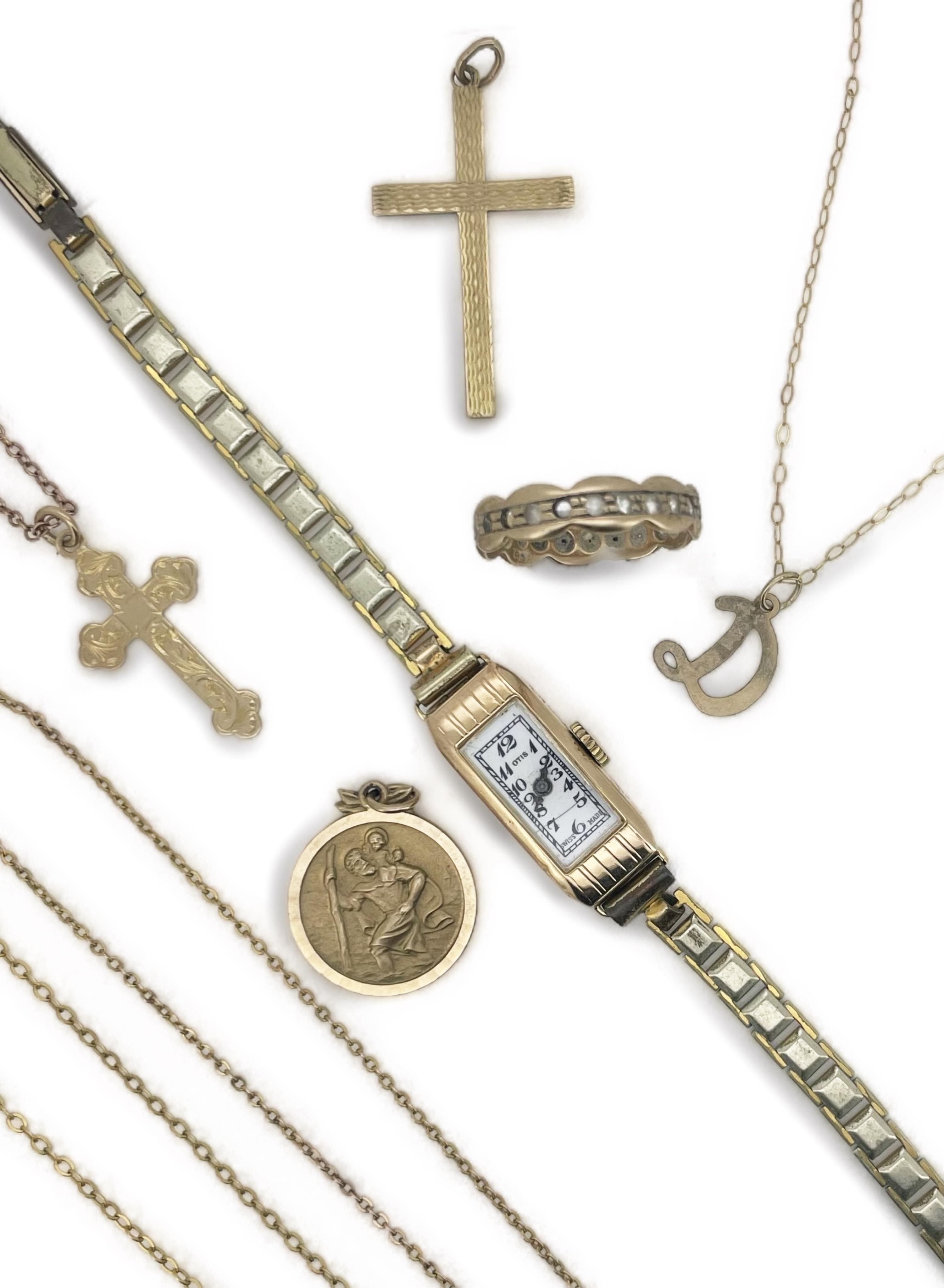 A collection of gold jewels, including a St Christopher pendant, British hallmarks, gross weight approximately 2.5 grams; a chain, two cross pendants, and a colourless paste eternity band, each stamped 9ct, combined gros